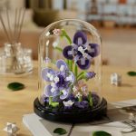 fleur artificielle sous cloche en verre